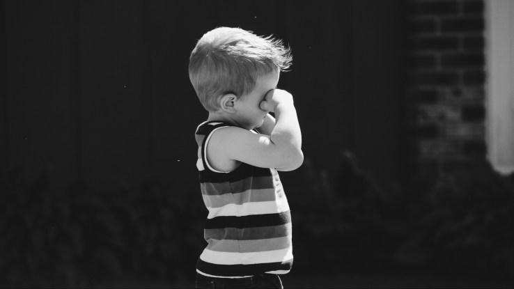 Rejected little boy, black and white photo